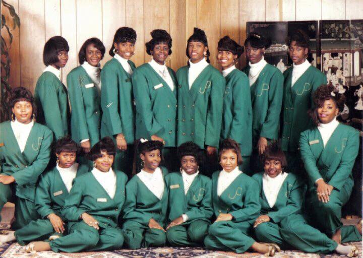 Group of possible sorrority women wearing Green Suit Jackets, possibly AKAs